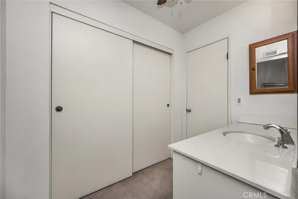 a bathroom with a sink and mirror