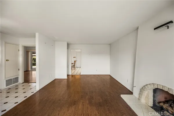 a view of a livingroom with wooden floor and space