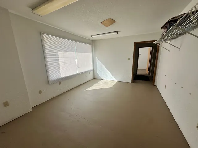 a kitchen with stainless steel appliances a refrigerator and a stove top oven