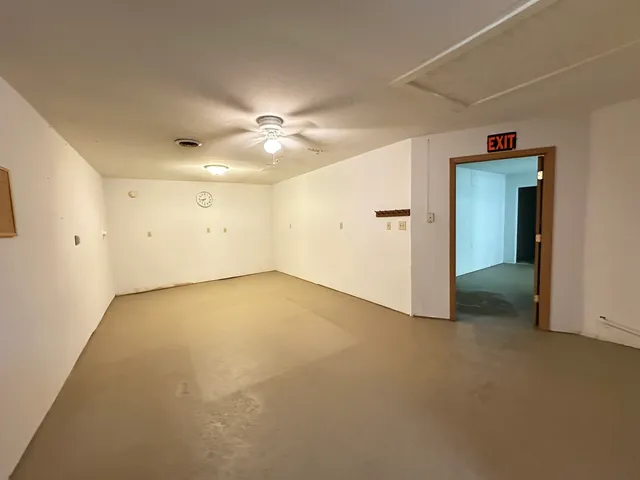 an empty room with a empty space and a window