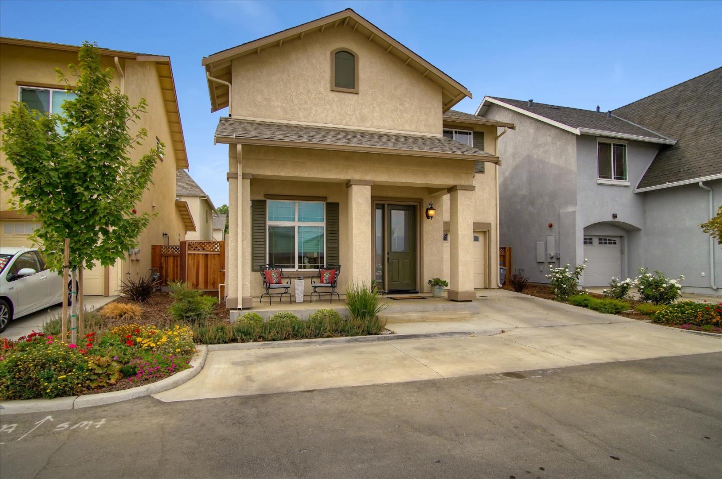 a front view of a house with a yard