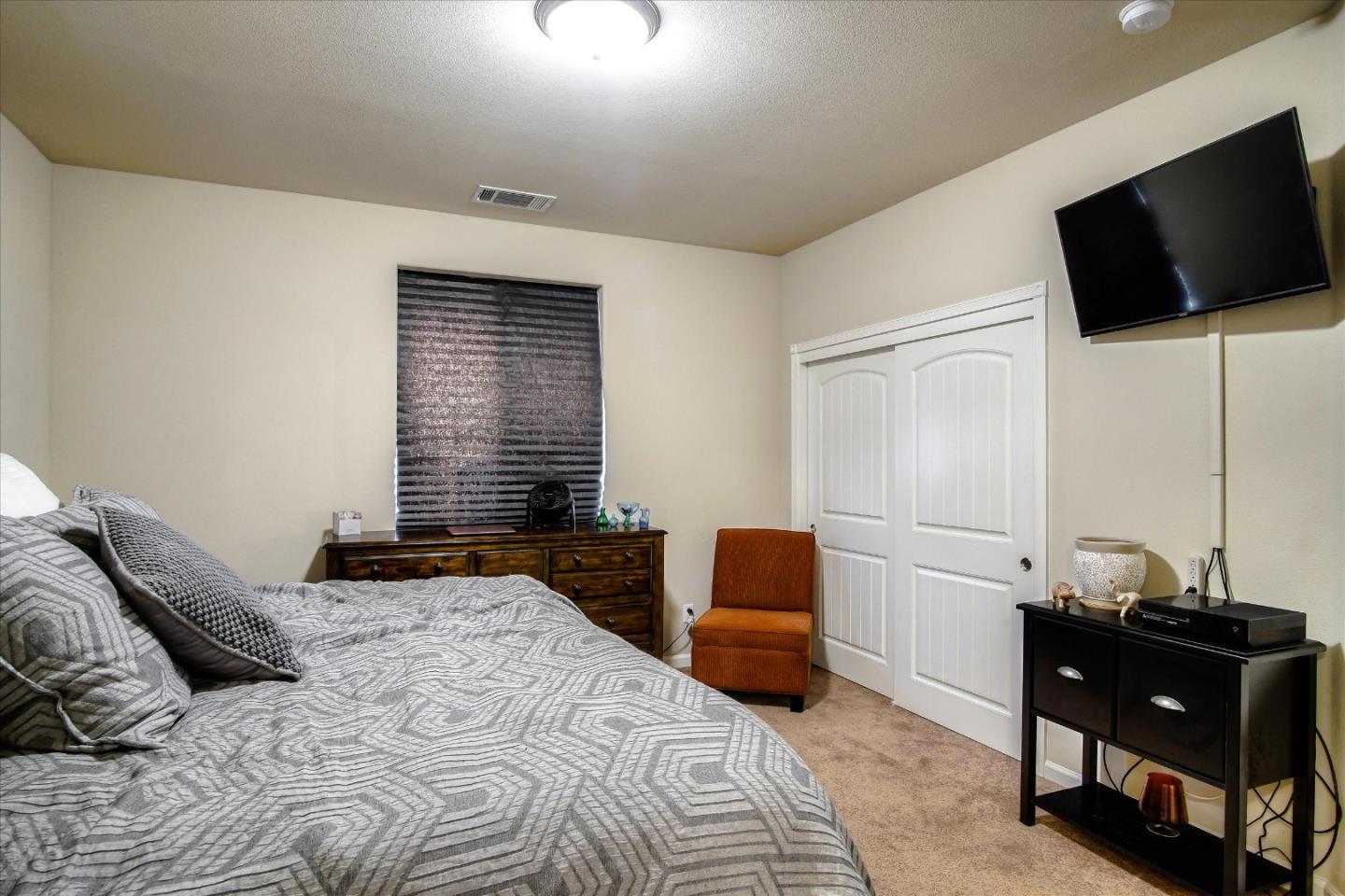 108 Springtime Circle Hollister, CA 95023 - Photo 13 of 36 a bedroom with a bed and a television