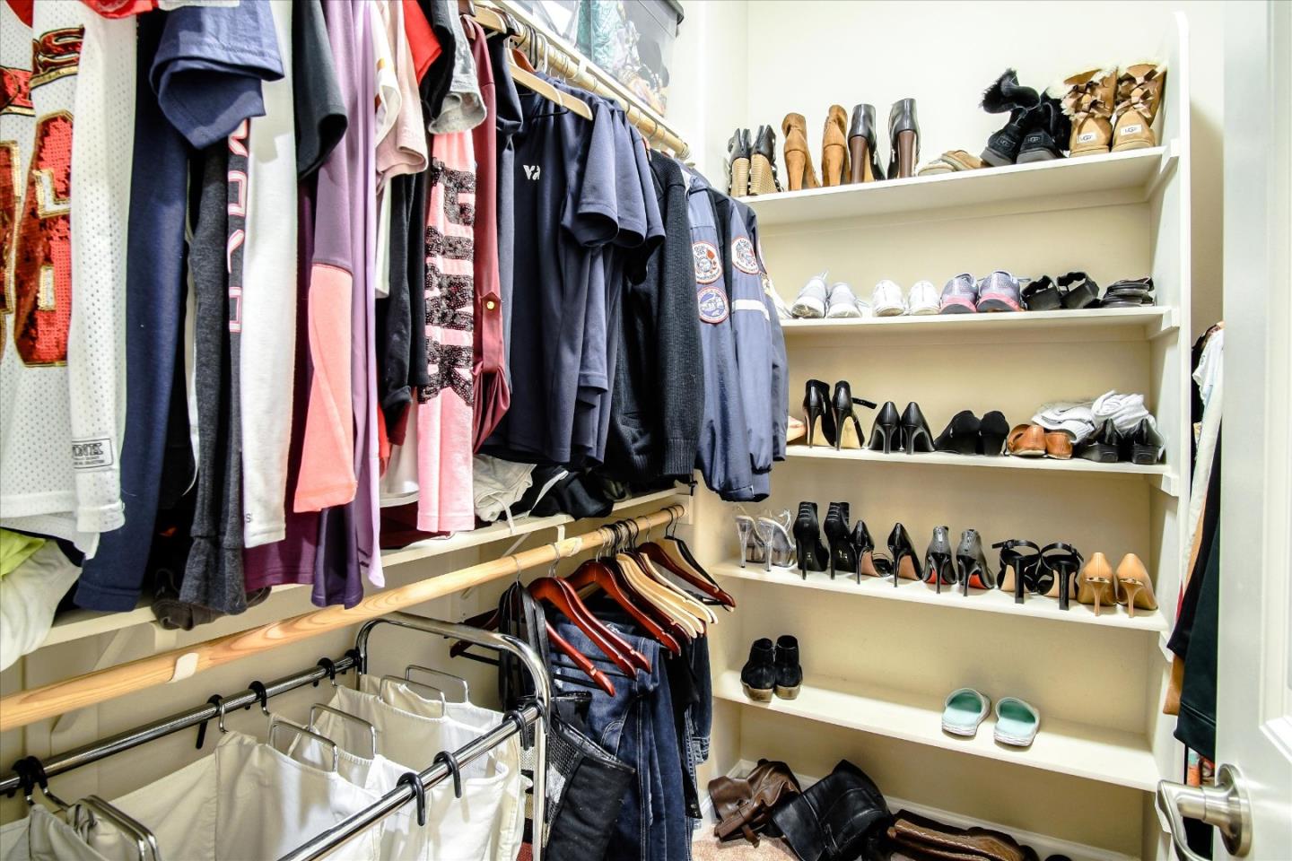108 Springtime Circle Hollister, CA 95023 - Photo 18 of 36 a view of walk in closet with clothes and shoes