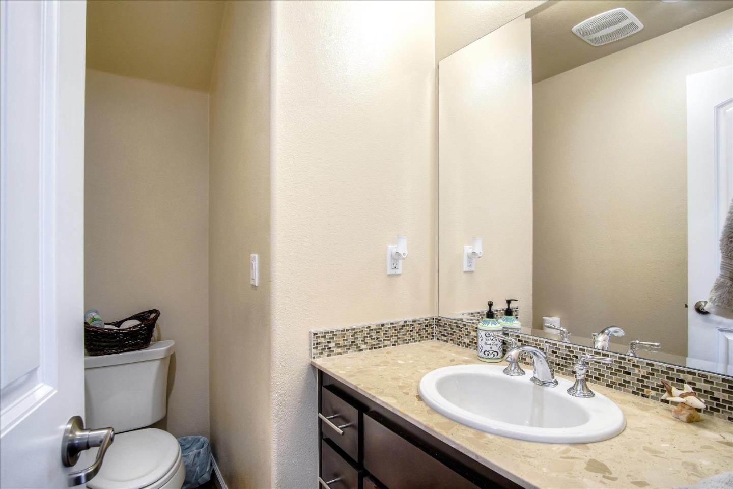 108 Springtime Circle Hollister, CA 95023 - Photo 19 of 36 a bathroom with a toilet sink and mirror