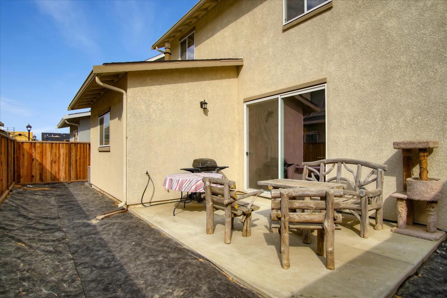 108 Springtime Circle Hollister, CA 95023 - Photo 25 of 36 a view of a dinning table and chairs in the patio