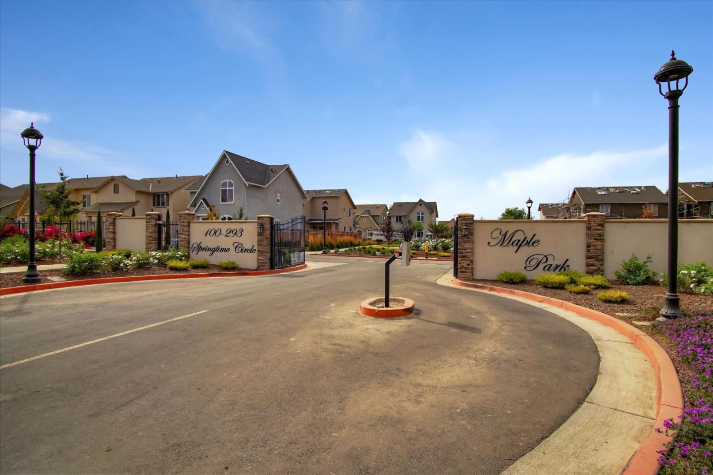 108 Springtime Circle Hollister, CA 95023 - Photo 27 of 36 a city view with tall buildings and cars parked on street side
