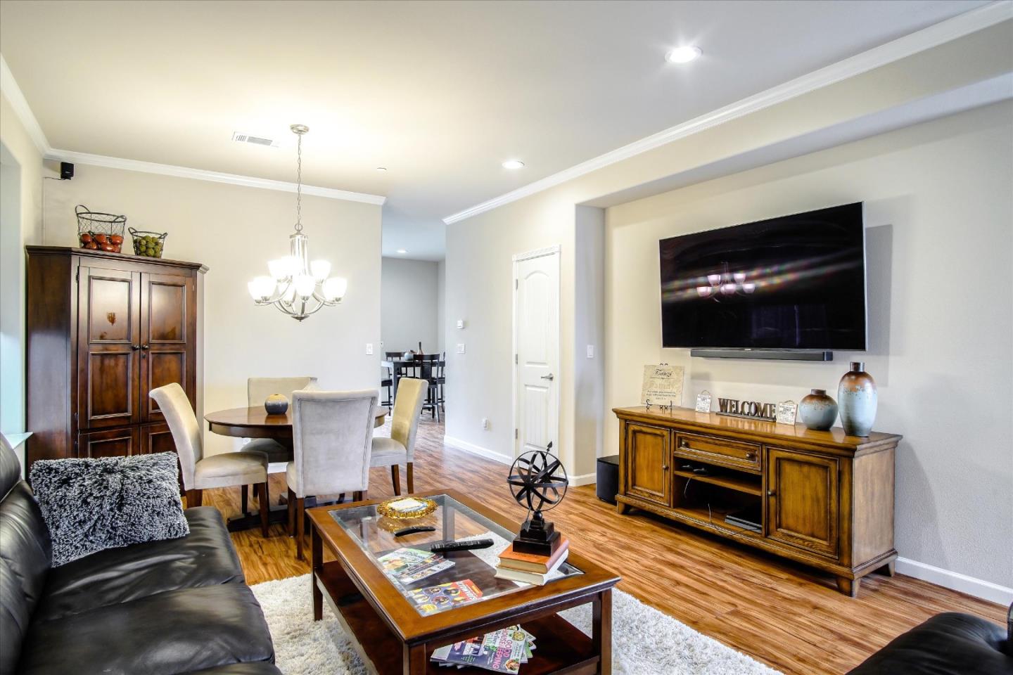 108 Springtime Circle Hollister, CA 95023 - Photo 34 of 36 a living room with furniture and a flat screen tv