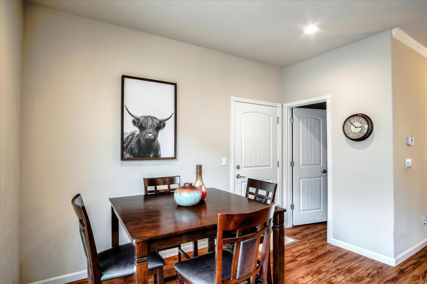 108 Springtime Circle Hollister, CA 95023 - Photo 6 of 36 a view of a dining room with furniture and wooden floor