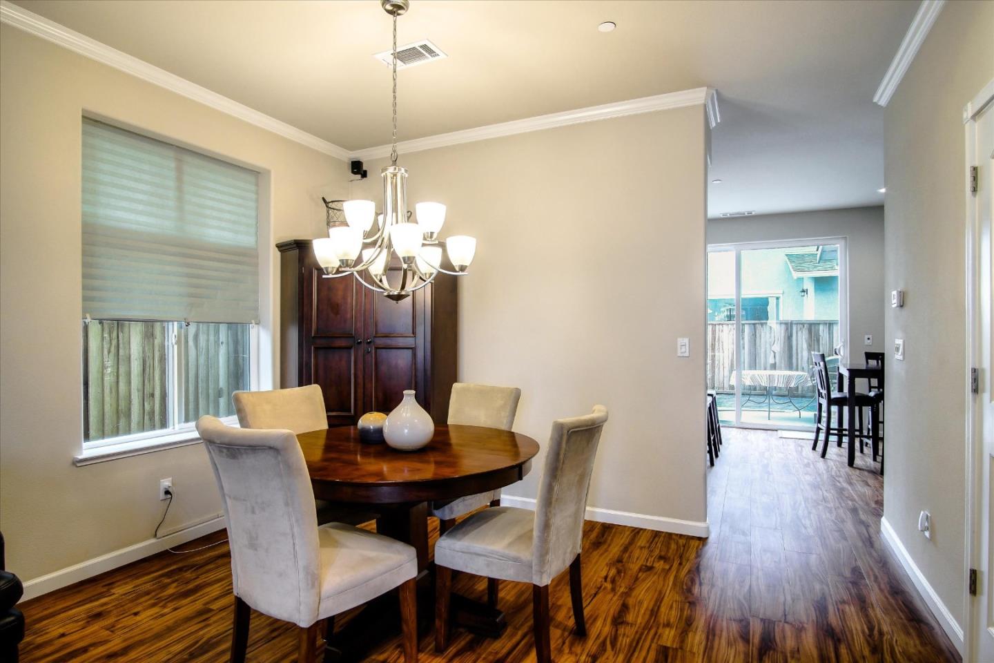 108 Springtime Circle Hollister, CA 95023 - Photo 7 of 36 a view of a dining room with furniture window and wooden floor