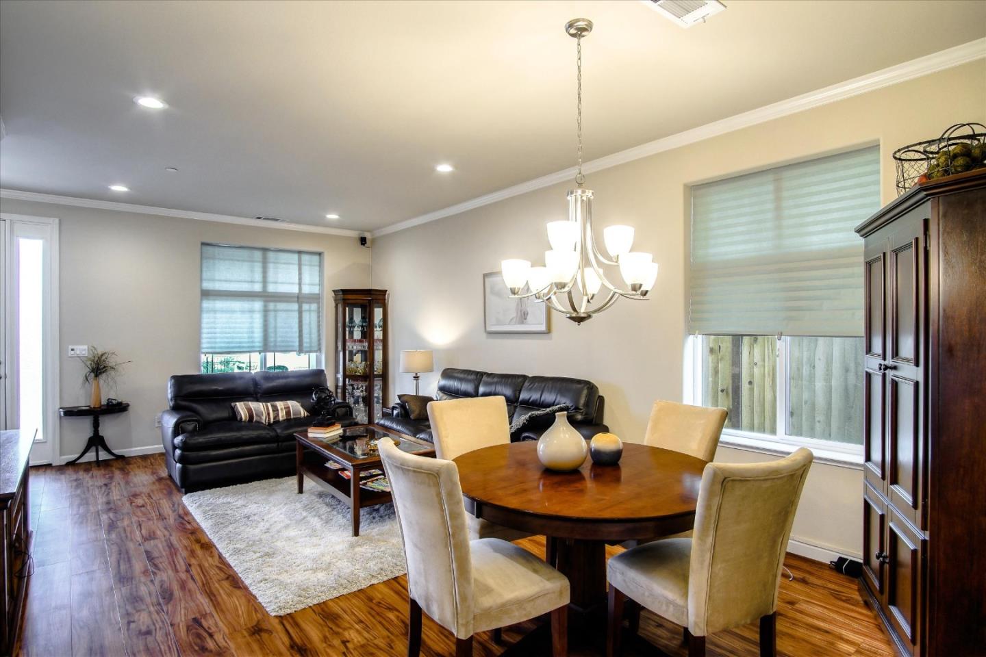 108 Springtime Circle Hollister, CA 95023 - Photo 8 of 36 a living room with furniture a window and a chandelier