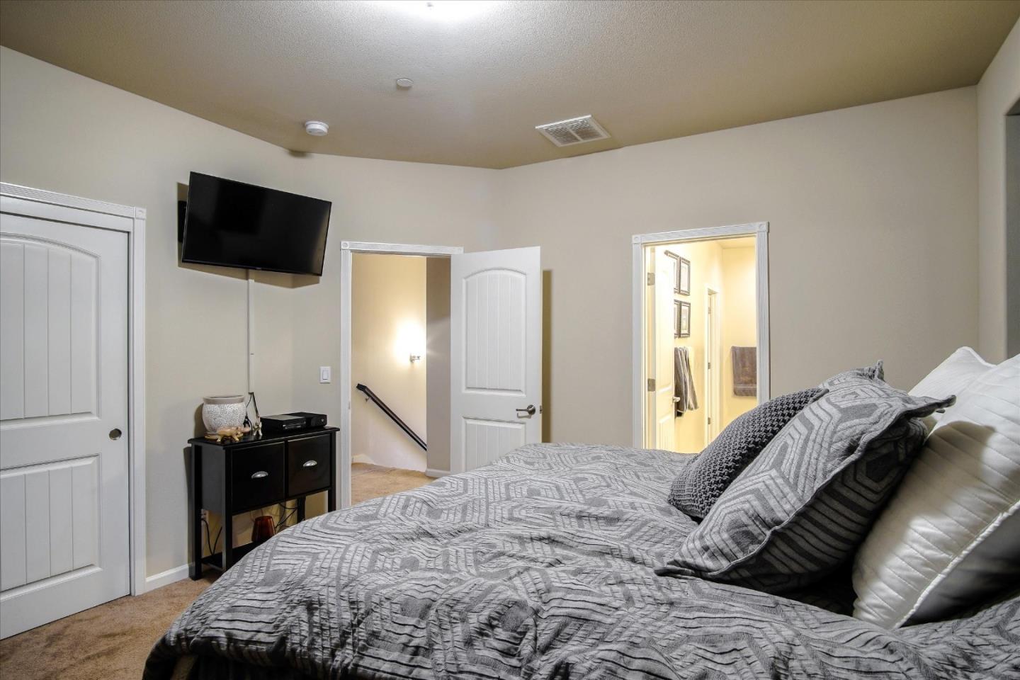 108 Springtime Circle Hollister, CA 95023 - Photo 10 of 36 a bedroom with a bed and a flat screen tv