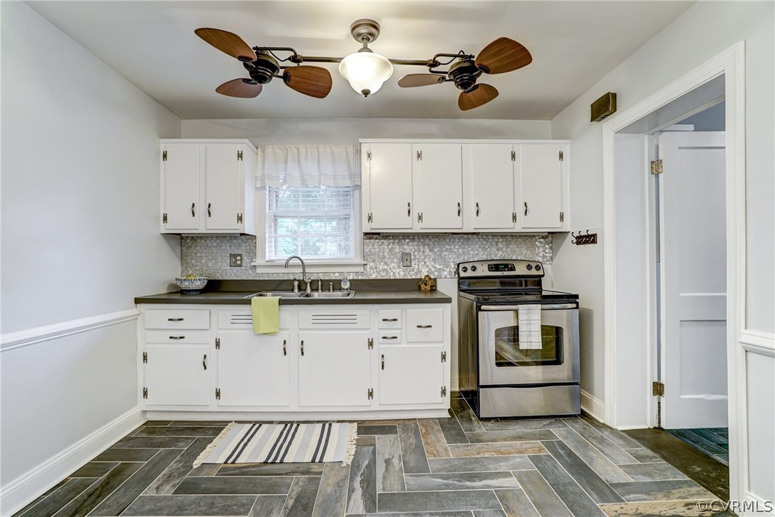 8908 Mapleton Road Henrico, VA 23229 - Photo 6 of 21 White Cabinets and Smooth Top Cooking