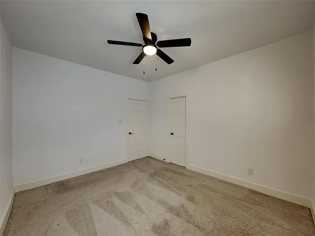 a view of a ceiling fan with wooden floor