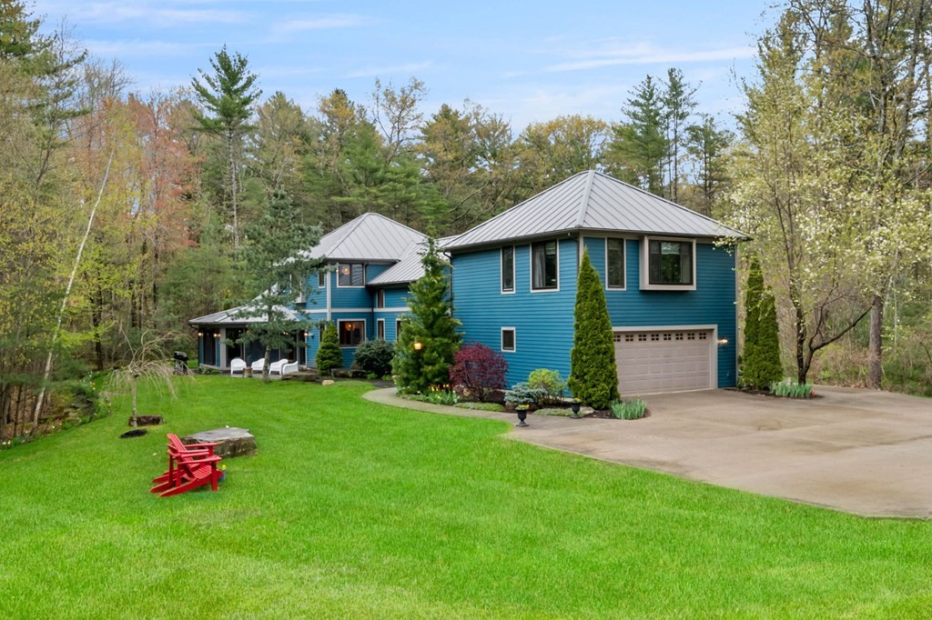 62 Buffam Road Pelham, MA 01002 - Photo 1 of 42 a front view of a house with garden