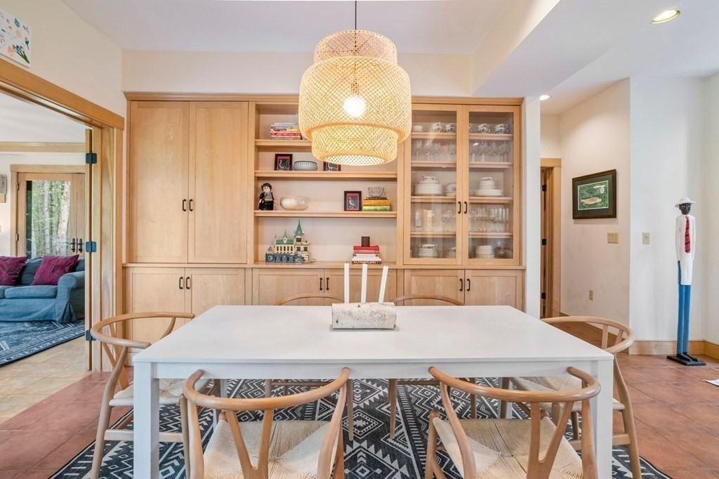 62 Buffam Road Pelham, MA 01002 - Photo 12 of 42 a kitchen with a table chairs and a refrigerator