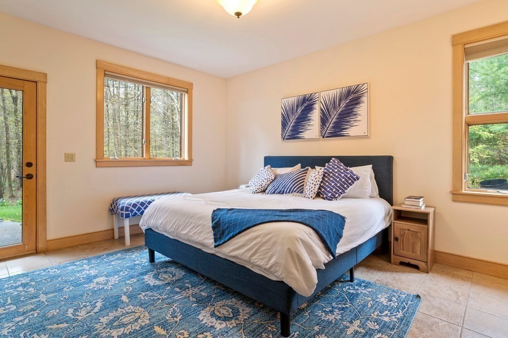 62 Buffam Road Pelham, MA 01002 - Photo 17 of 42 a bedroom with a bed and window