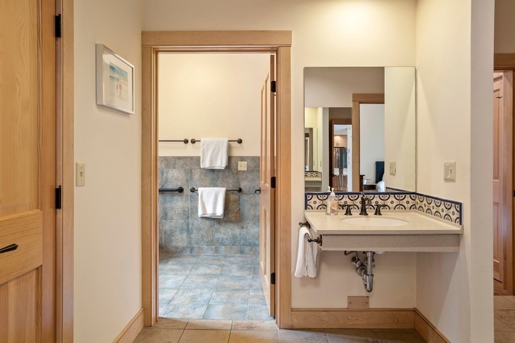 62 Buffam Road Pelham, MA 01002 - Photo 20 of 42 a bathroom with a sink a mirror and a shower