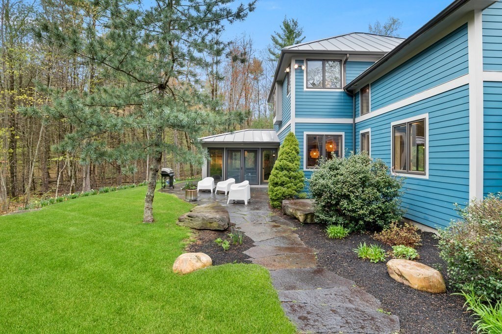 62 Buffam Road Pelham, MA 01002 - Photo 3 of 42 a front view of a house with garden