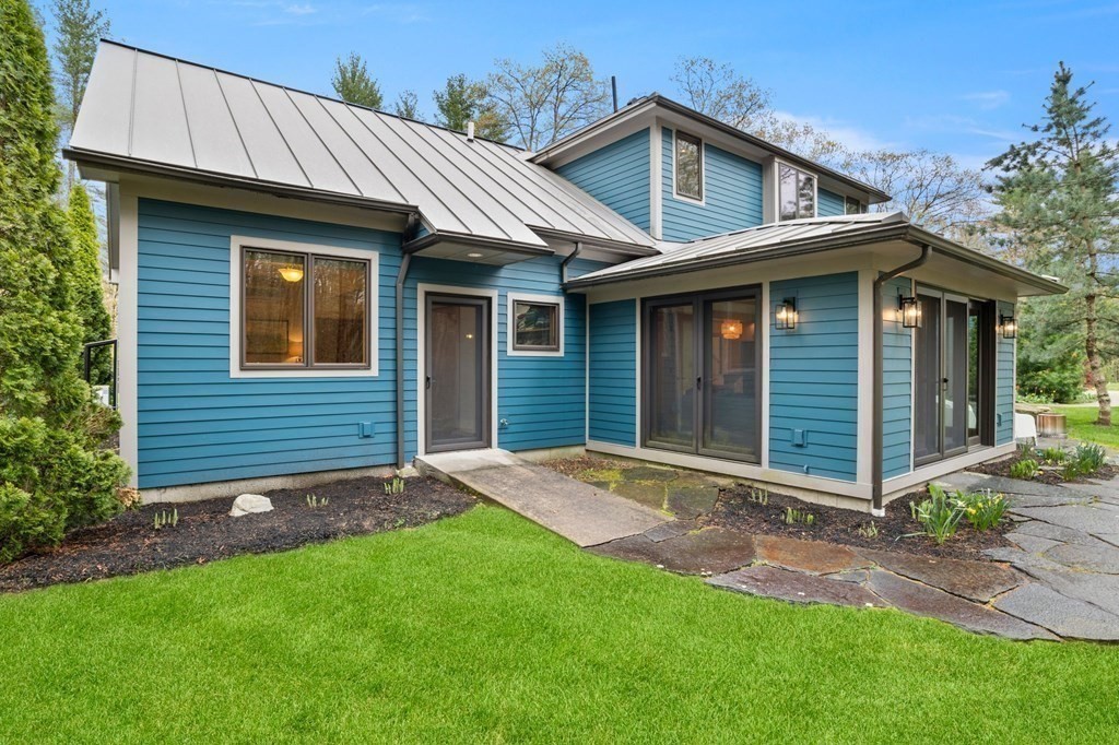 62 Buffam Road Pelham, MA 01002 - Photo 36 of 42 a front view of a house with a garden and yard