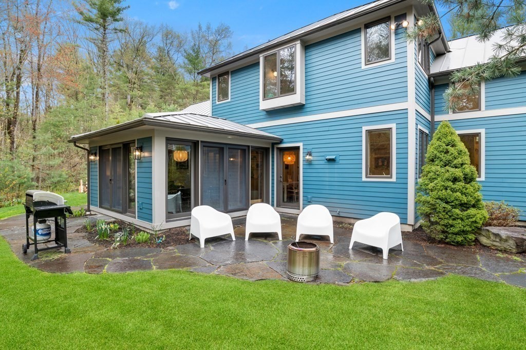 62 Buffam Road Pelham, MA 01002 - Photo 37 of 42 a view of a house with a yard and sitting area