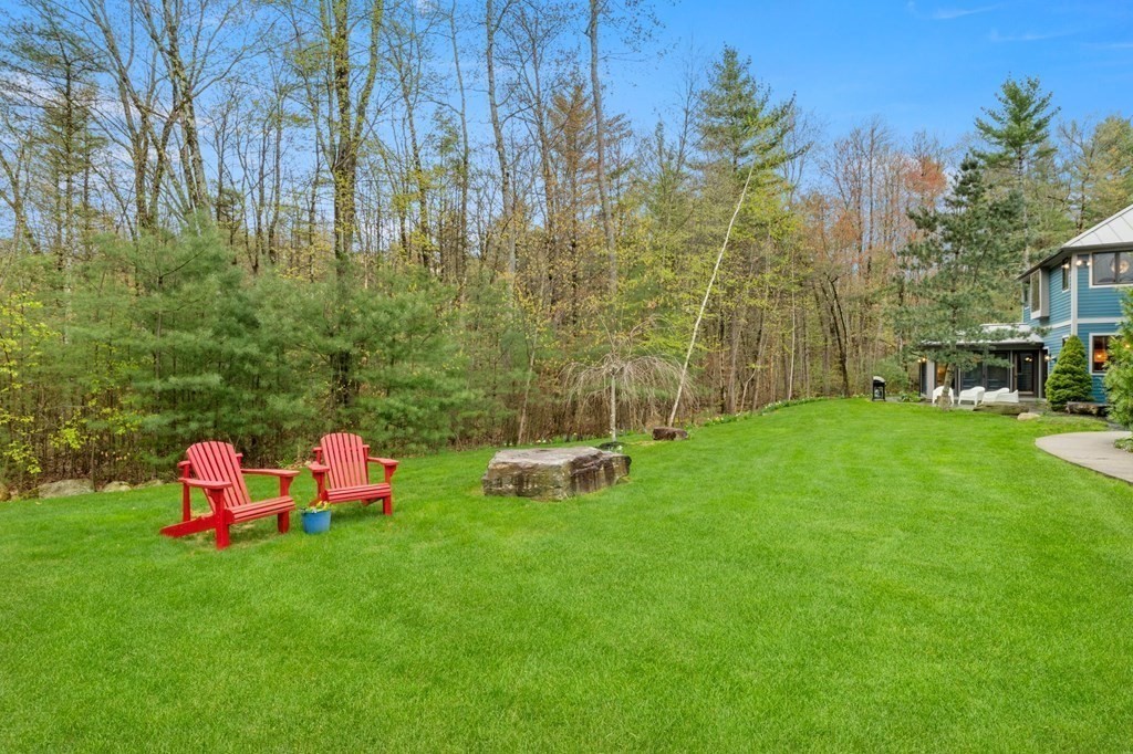 62 Buffam Road Pelham, MA 01002 - Photo 39 of 42 a backyard of a house with table and chairs