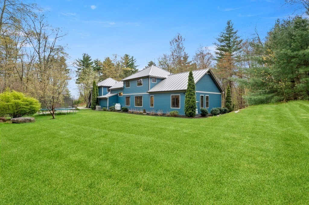 62 Buffam Road Pelham, MA 01002 - Photo 40 of 42 a front view of house with a garden