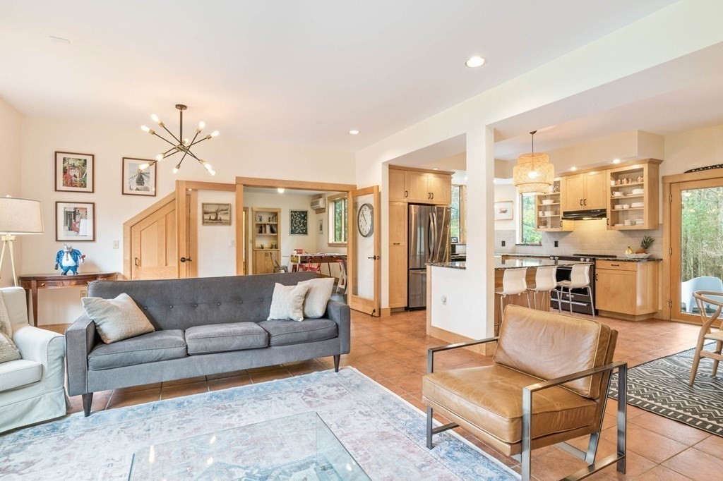 62 Buffam Road Pelham, MA 01002 - Photo 4 of 42 a living room with furniture kitchen view and a chandelier