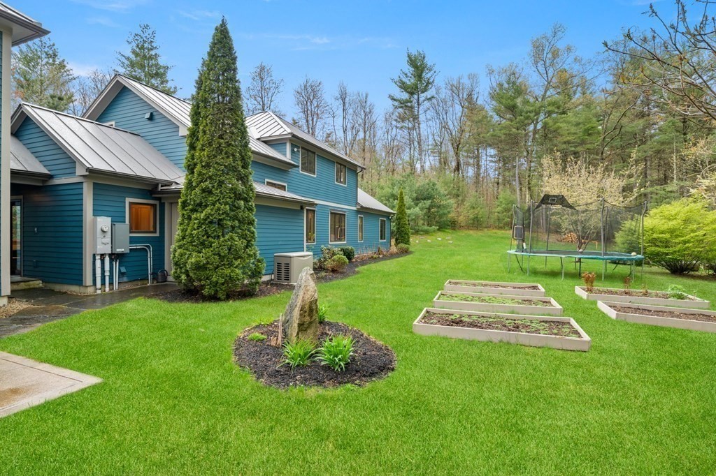 62 Buffam Road Pelham, MA 01002 - Photo 41 of 42 a front view of a house with a yard