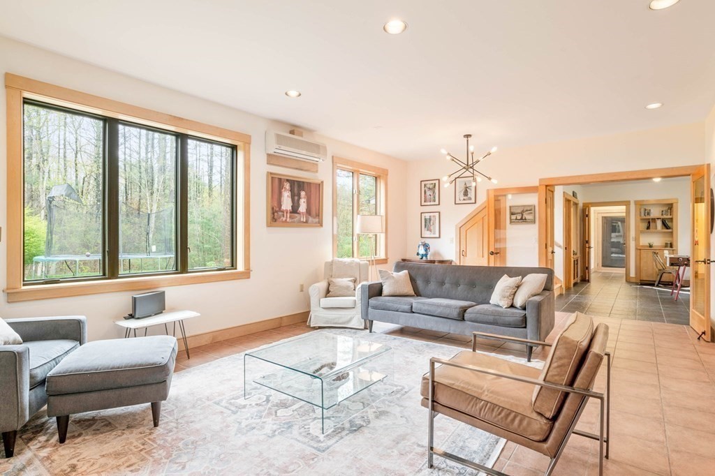 62 Buffam Road Pelham, MA 01002 - Photo 5 of 42 a living room with furniture and large windows
