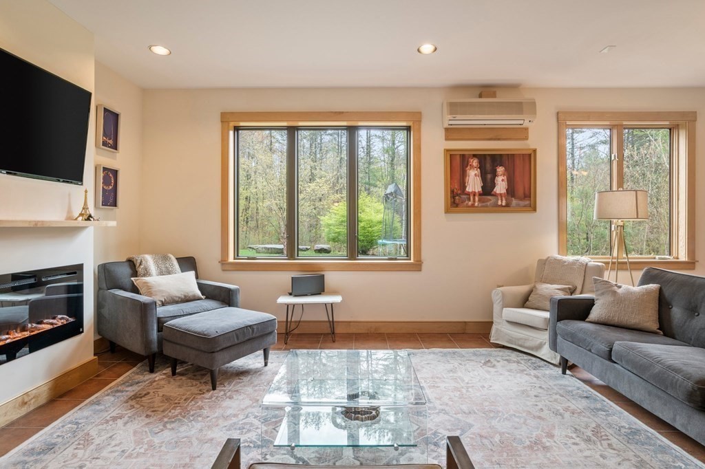 62 Buffam Road Pelham, MA 01002 - Photo 6 of 42 a living room with furniture and a flat screen tv