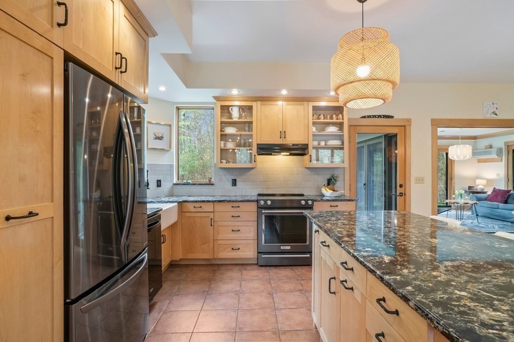 62 Buffam Road Pelham, MA 01002 - Photo 10 of 42 a kitchen with stainless steel appliances granite countertop a sink a stove and a refrigerator