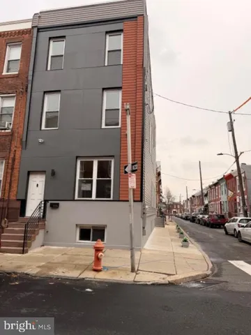 a view of a street with cars
