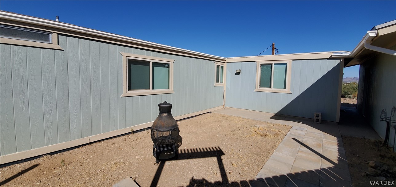 3469 Kayenta Road Golden Valley, AZ 86413 - Photo 6 of 49 a balcony with table and chairs