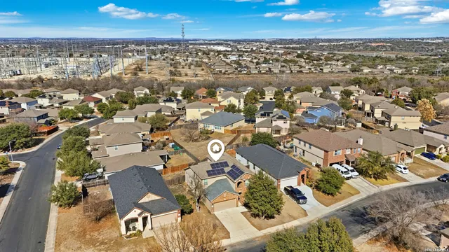 an aerial view of residential houses with outdoor space