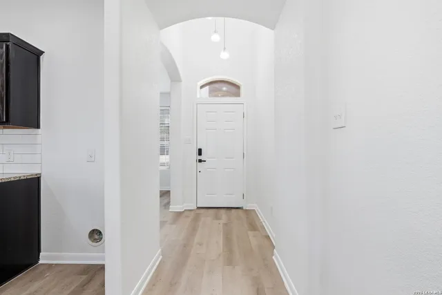 a view of a livingroom with wooden floor