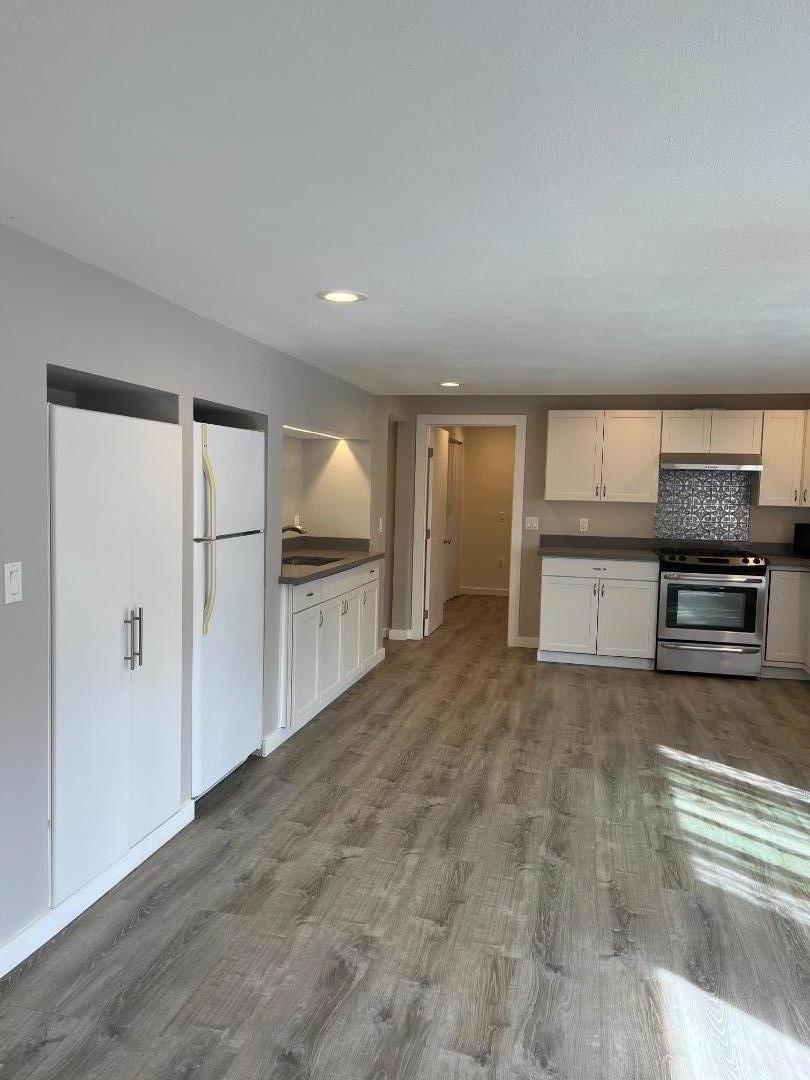 5 Malavear Court, Unit INLAW Pacifica, CA 94044 - Photo 3 of 13 a view of a kitchen with a sink and an oven