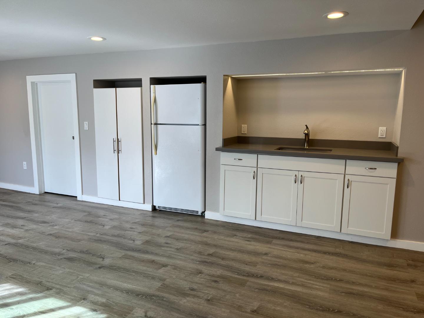 5 Malavear Court, Unit INLAW Pacifica, CA 94044 - Photo 4 of 13 a view of cabinets with wooden floor