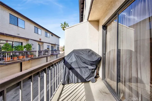 a view of balcony with furniture