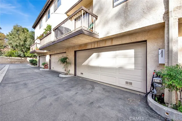 a view of a house with a yard and garage