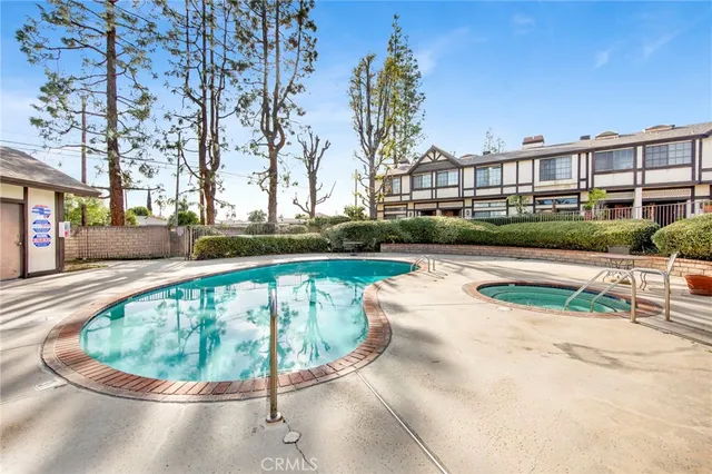 a view of a swimming pool with a patio