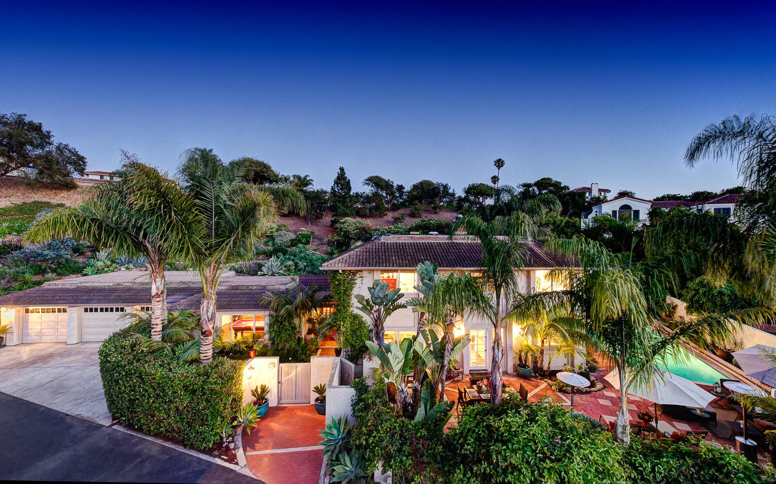 an aerial view of a houses with a yard