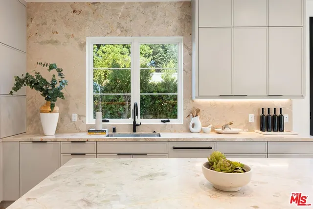 a kitchen with a sink and a window