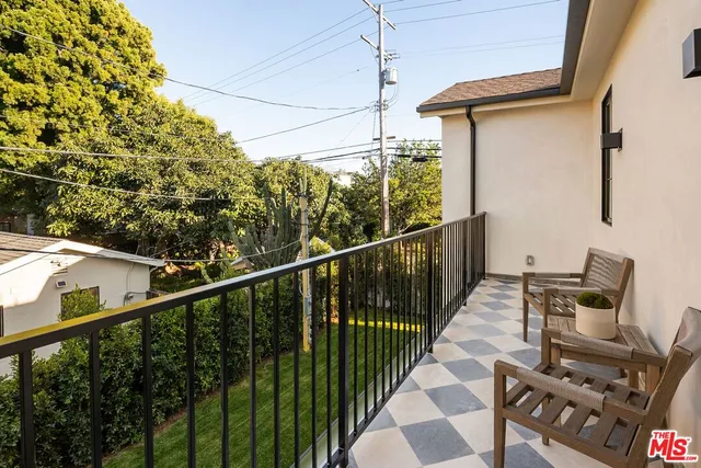 a view of balcony with furniture