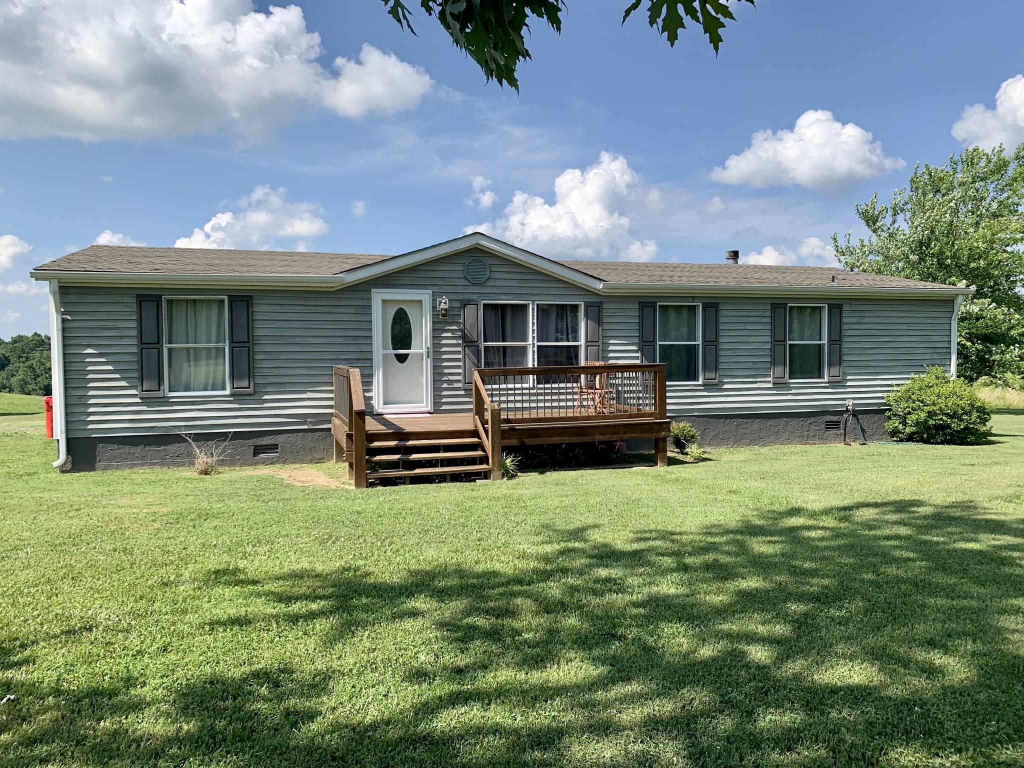1145 Boyd Road Lafayette, TN 37083 - Photo 2 of 17 a front view of a house with a yard