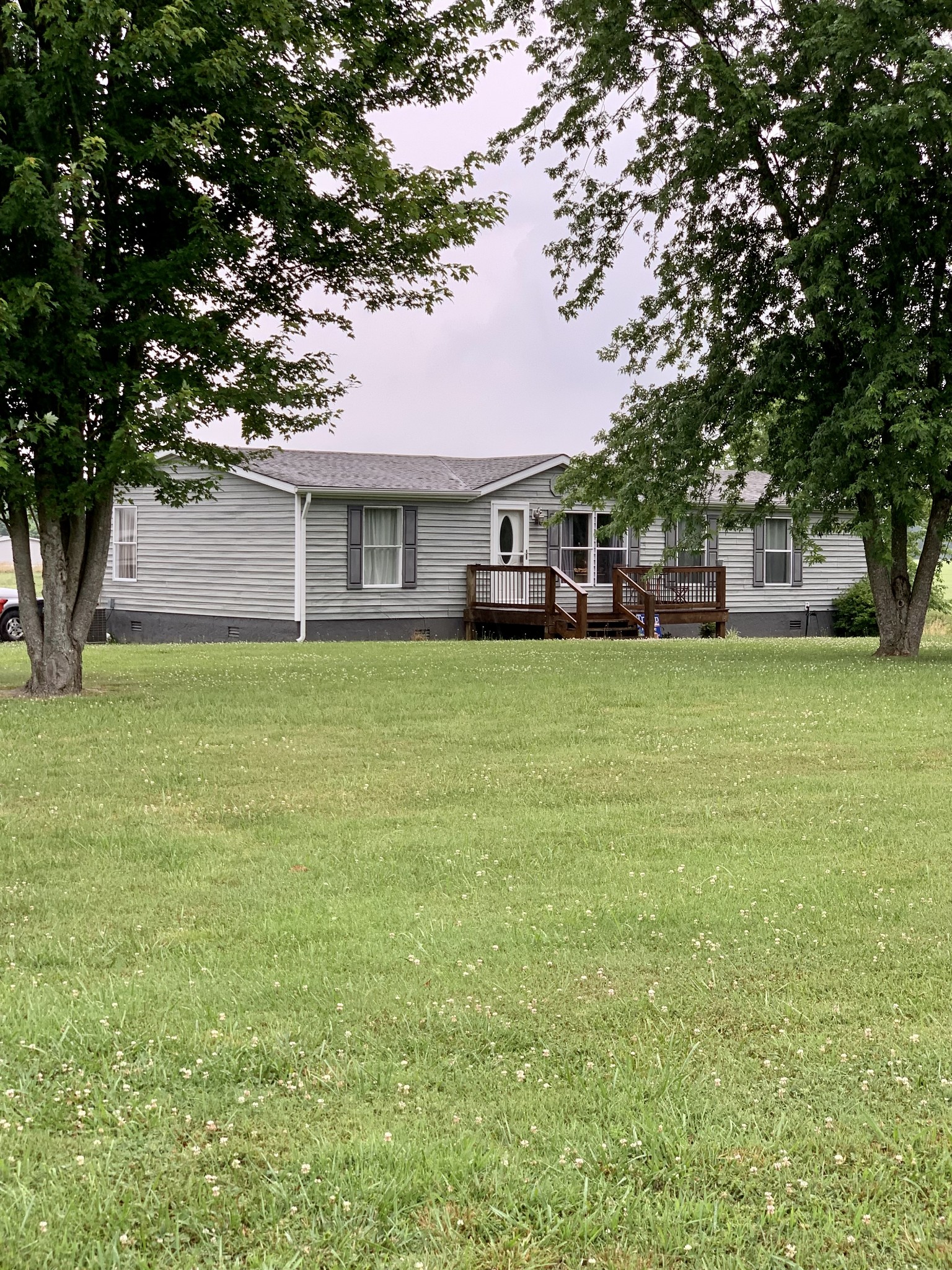 1145 Boyd Road Lafayette, TN 37083 - Photo 17 of 17 a front view of a house with a garden