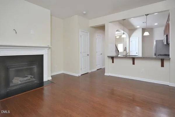 a view of a kitchen with a sink and a fireplace
