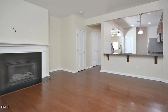 a view of a kitchen with a sink and a fireplace