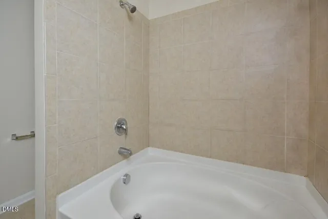 a bathroom with a white bath tub