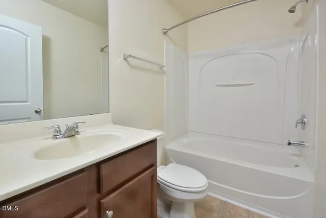 a bathroom with a sink a toilet and a bathtub