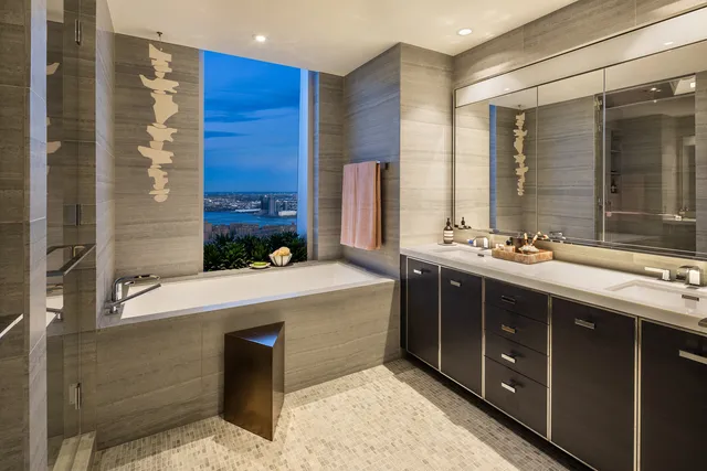 a bedroom with a bed and glass window